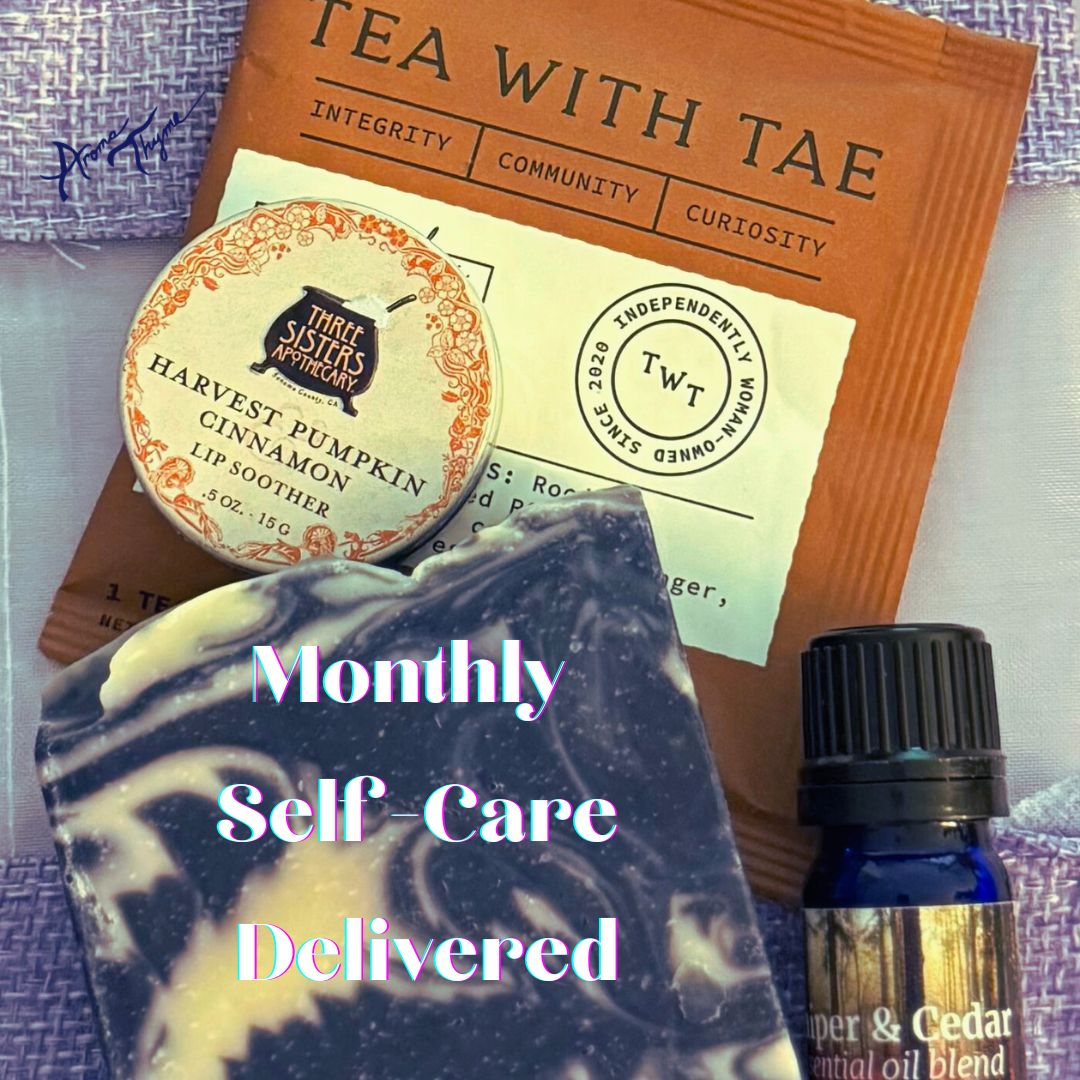 Tea with Tae package with moonlight blue aromatherapy soap , harvest pumpkin cinnamon lip soother, and essential oil blend on a textured surface