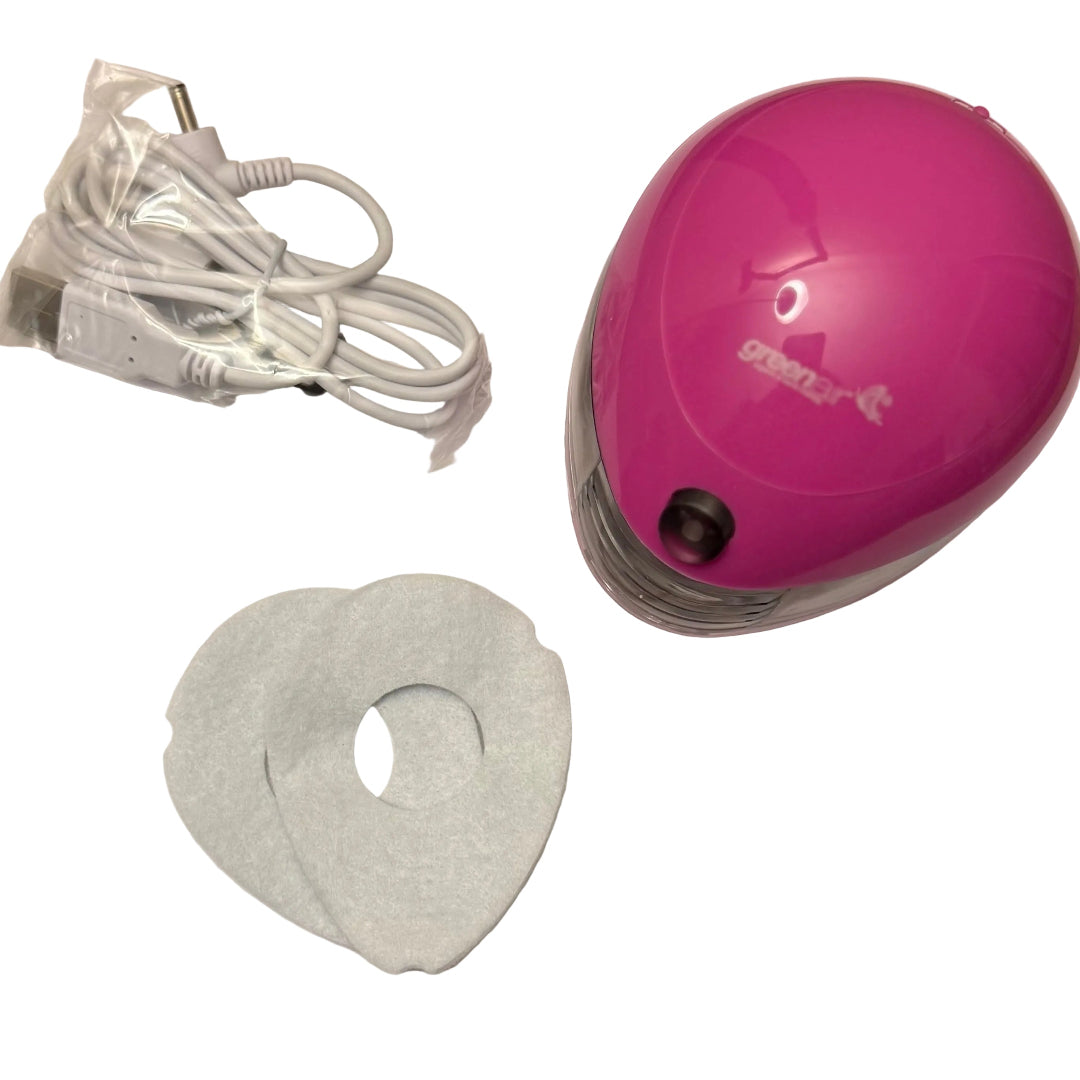 pink aroma pod diffuser with a cable and 2 replacement pads on a white background